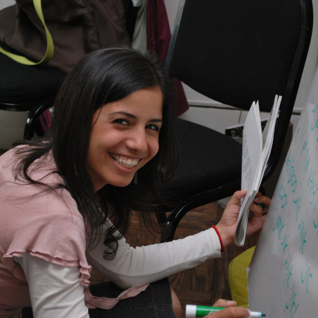 Photo of an ulpan student writing